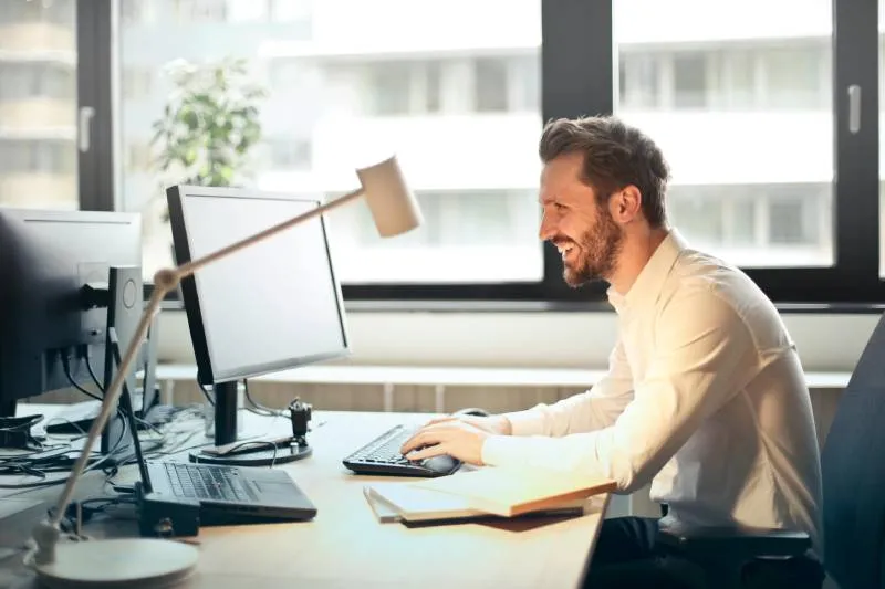 Man working on a computer at an office desk